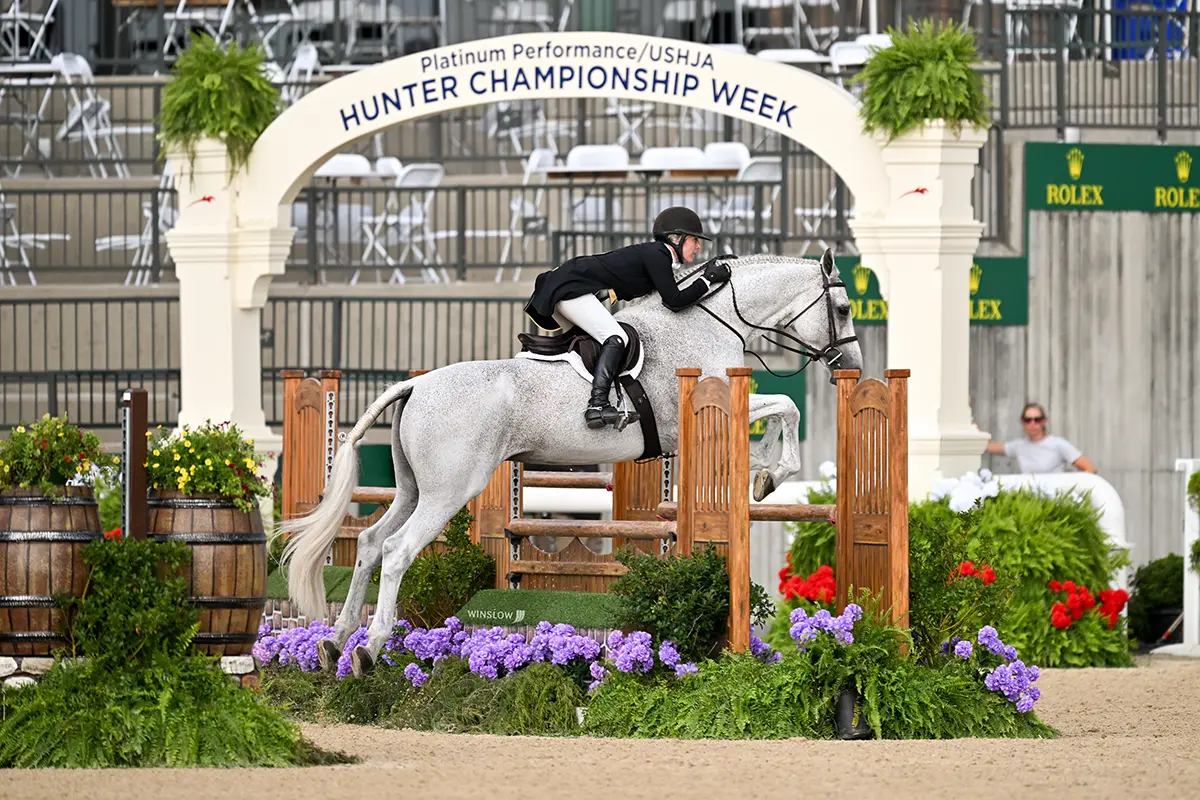Ashley riding during training at Charming Bay Farm