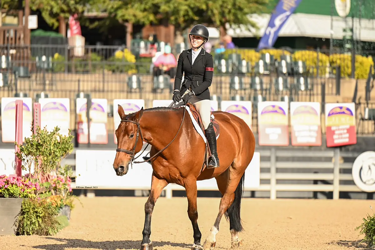 Rider smiling with horse at Charming Bay Farm